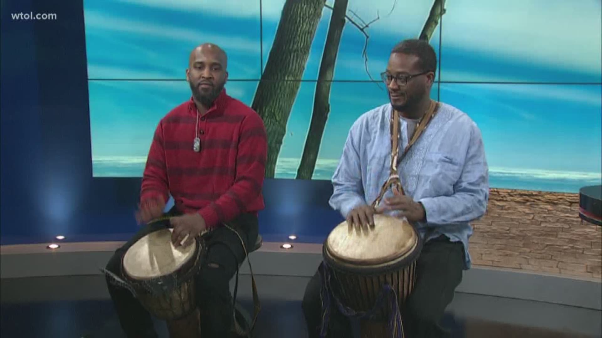 Mott Library Branch Manager Kim Penn and drummers from JP Dynasty show a taste of African culture.