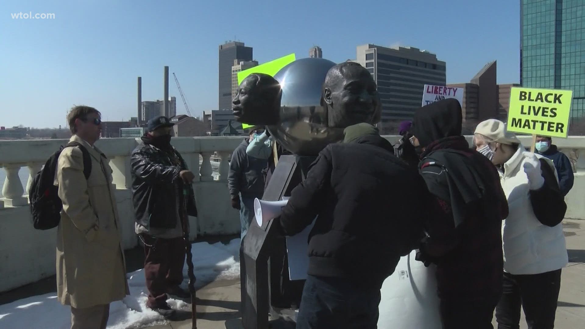 A group honoring John Lewis marched across Toledo's MLK bridge on Saturday, signifying the historic marches across the Edmund Pettus Bridge in Alabama.