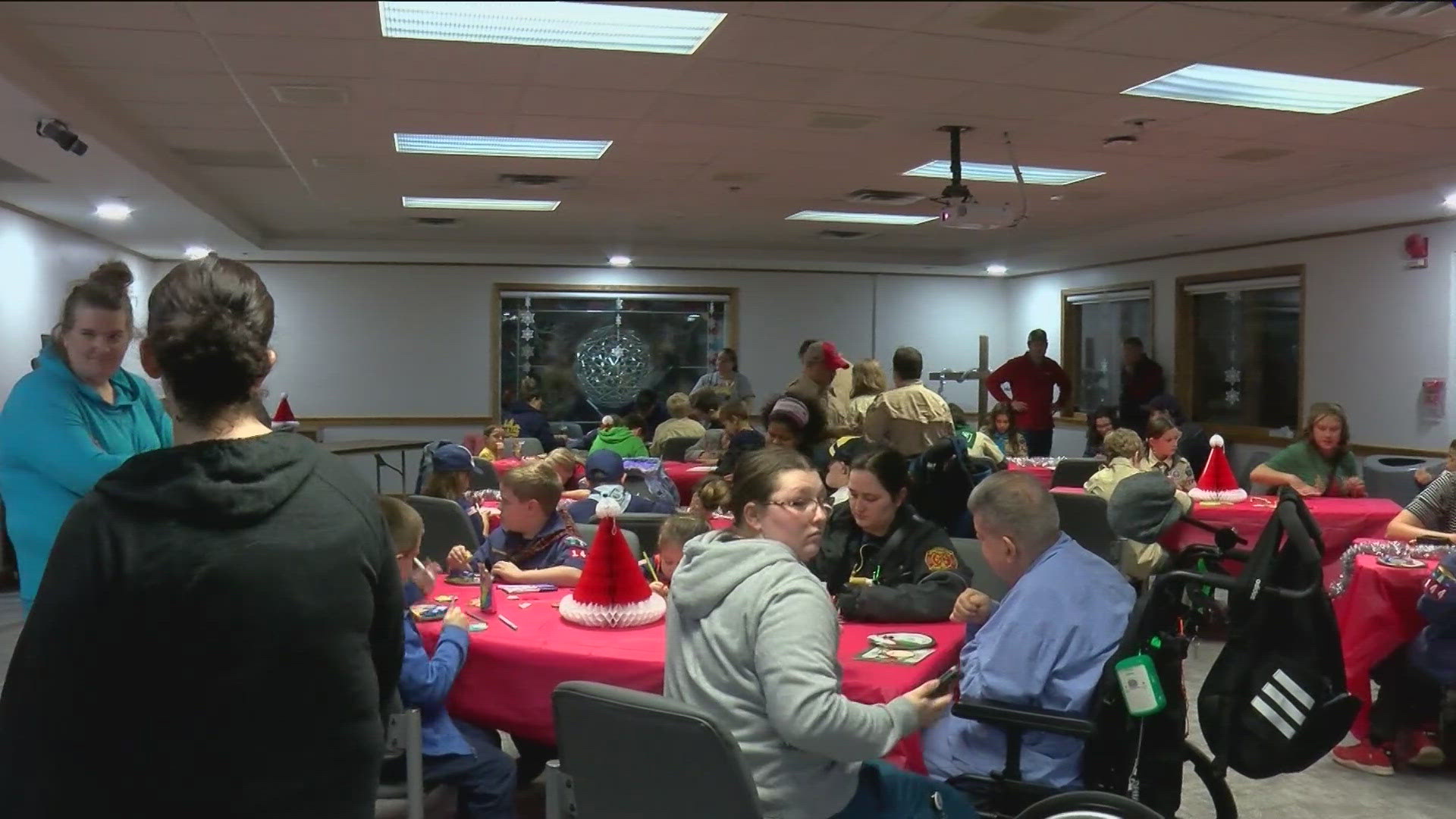 Cub Scouts from Pack 144 brought gifts to the developmentally disabled residents of Sunshine Communities in Maumee but also got something in return.