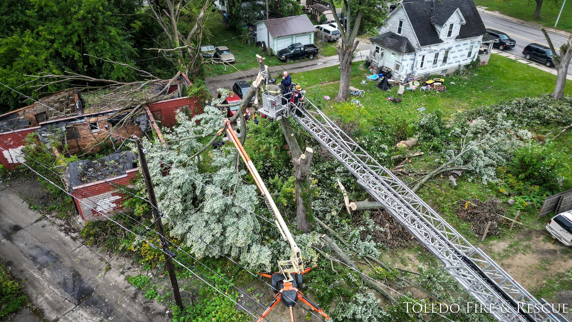 Drone video from the Toledo Fire & Rescue Department shows crews rescuing a tree trimming worker who was trapped in a boom lift Monday.