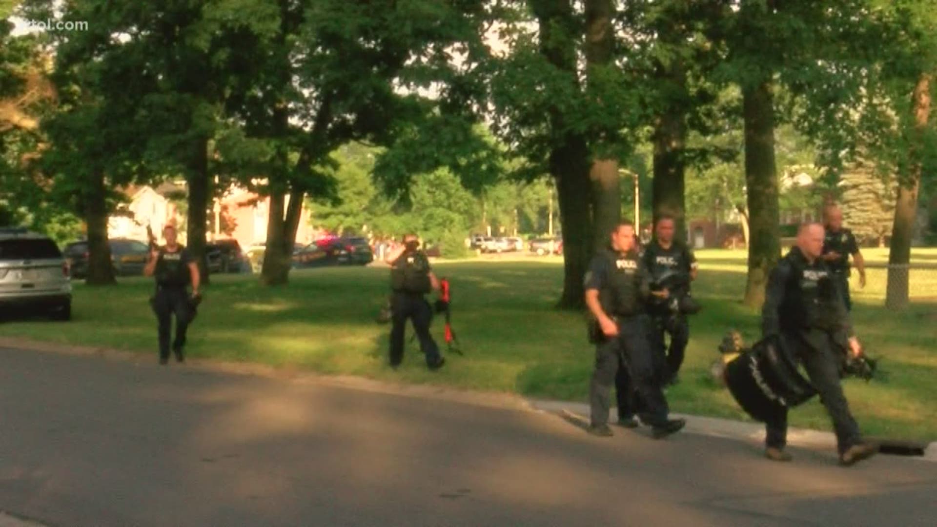 Officers used tear gas to end the incident, which is believed to have started with a neighbor dispute.