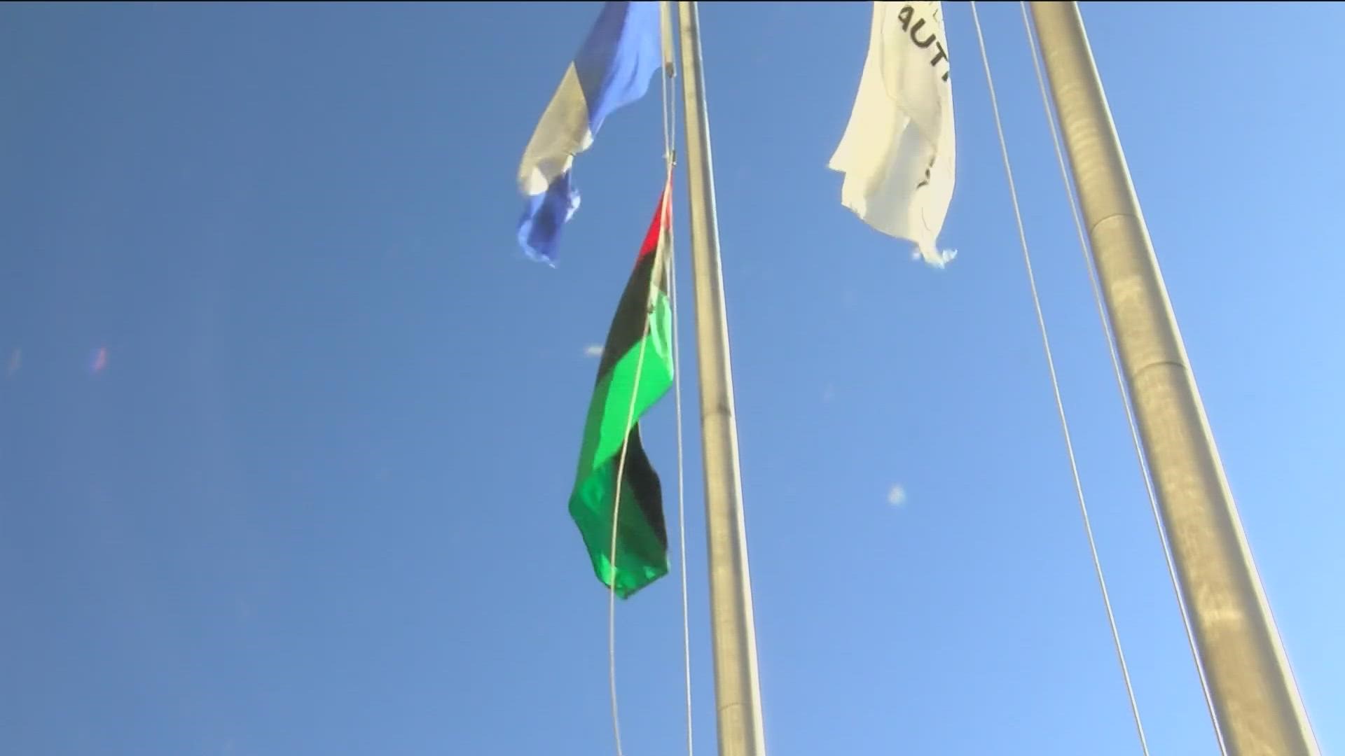 Toledo city officials raise flag for Black History Month.