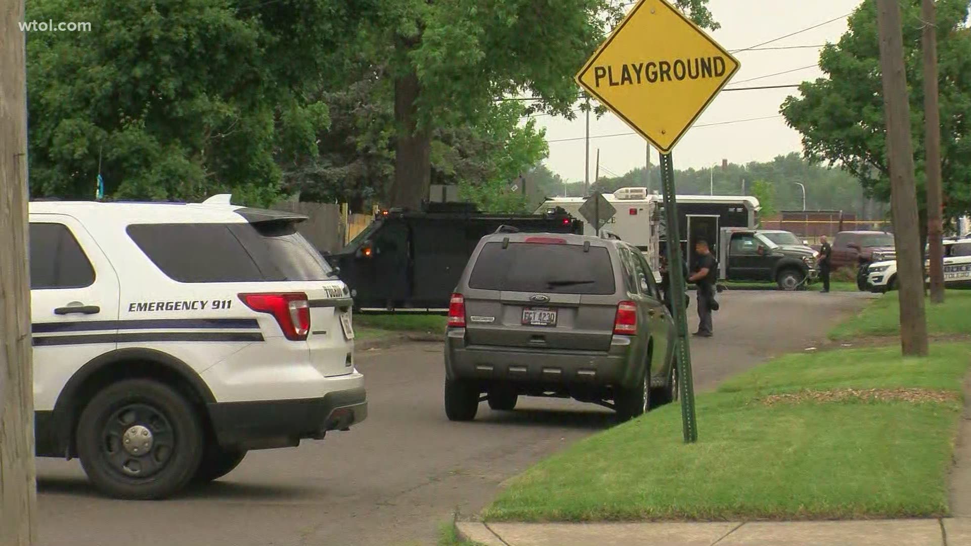 Our crews at the scene say a woman walked out of the house with her hands up with at least found children following behind her. Police put her in handcuffs.