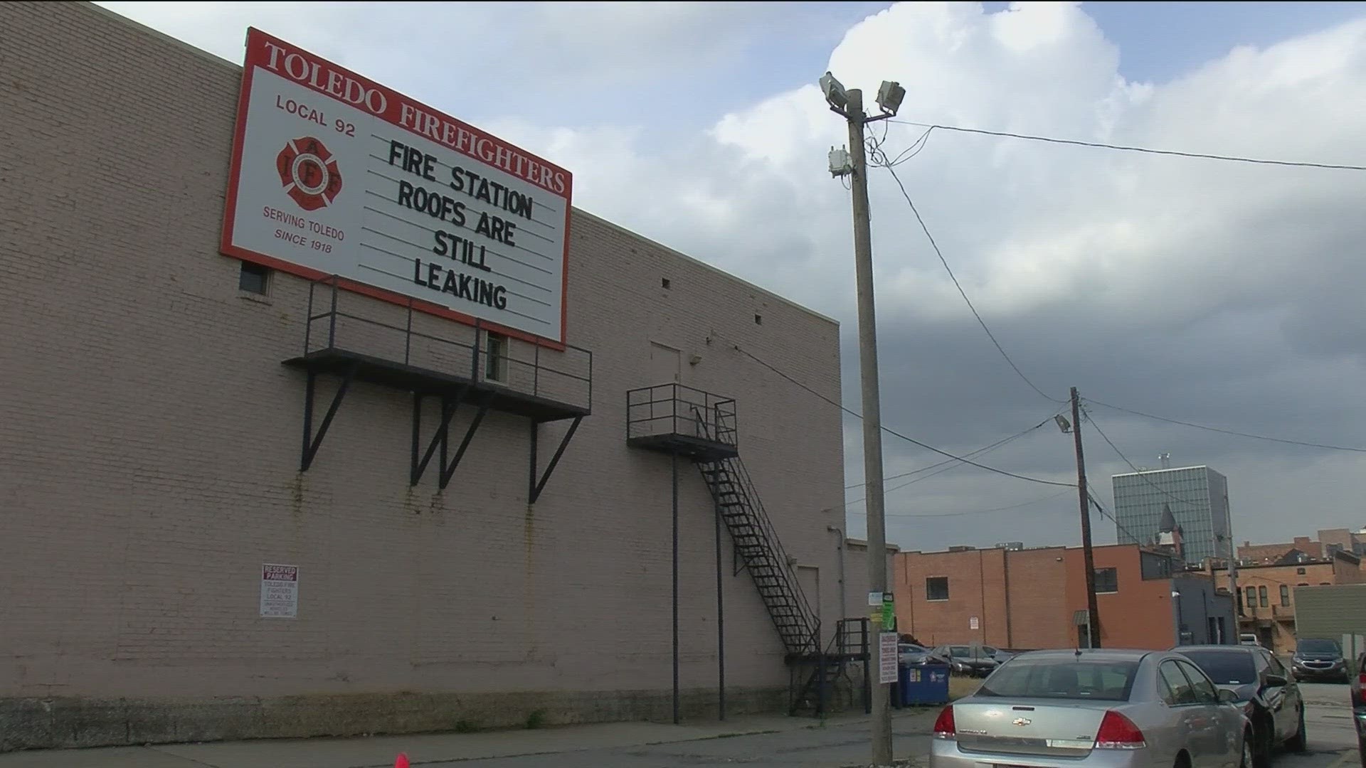 Local 92 posted to its downtown billboard reminding the city of leaking roofs. The city allocated millions of dollars to repair the department's facilities.