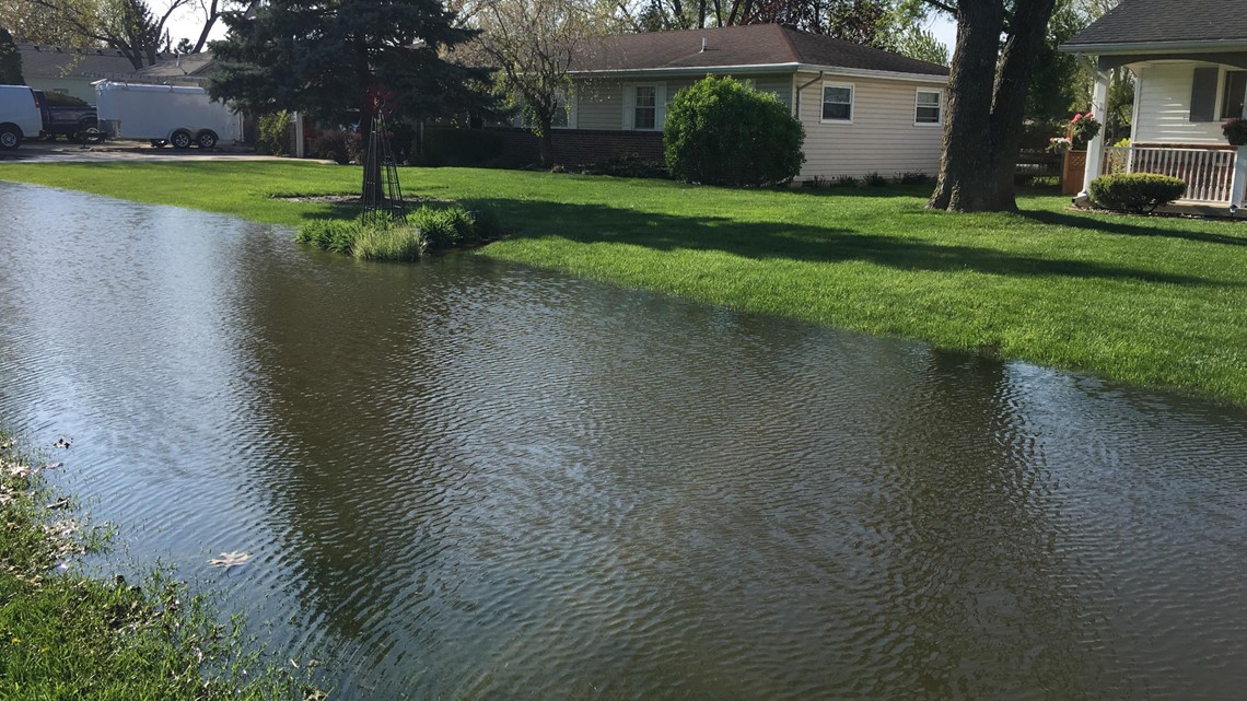Neighbors react to fourth flood at their home this year