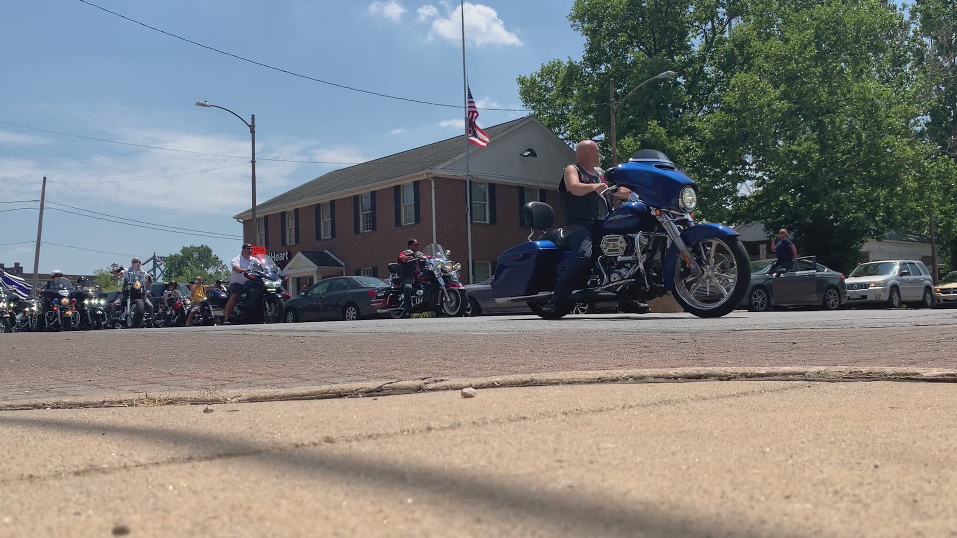 A procession of motorcycles and motorcycles and Jeeps made there way from S. Superior St. to the Safety Building downtown on Sunday afternoon to honor fallen Toledo