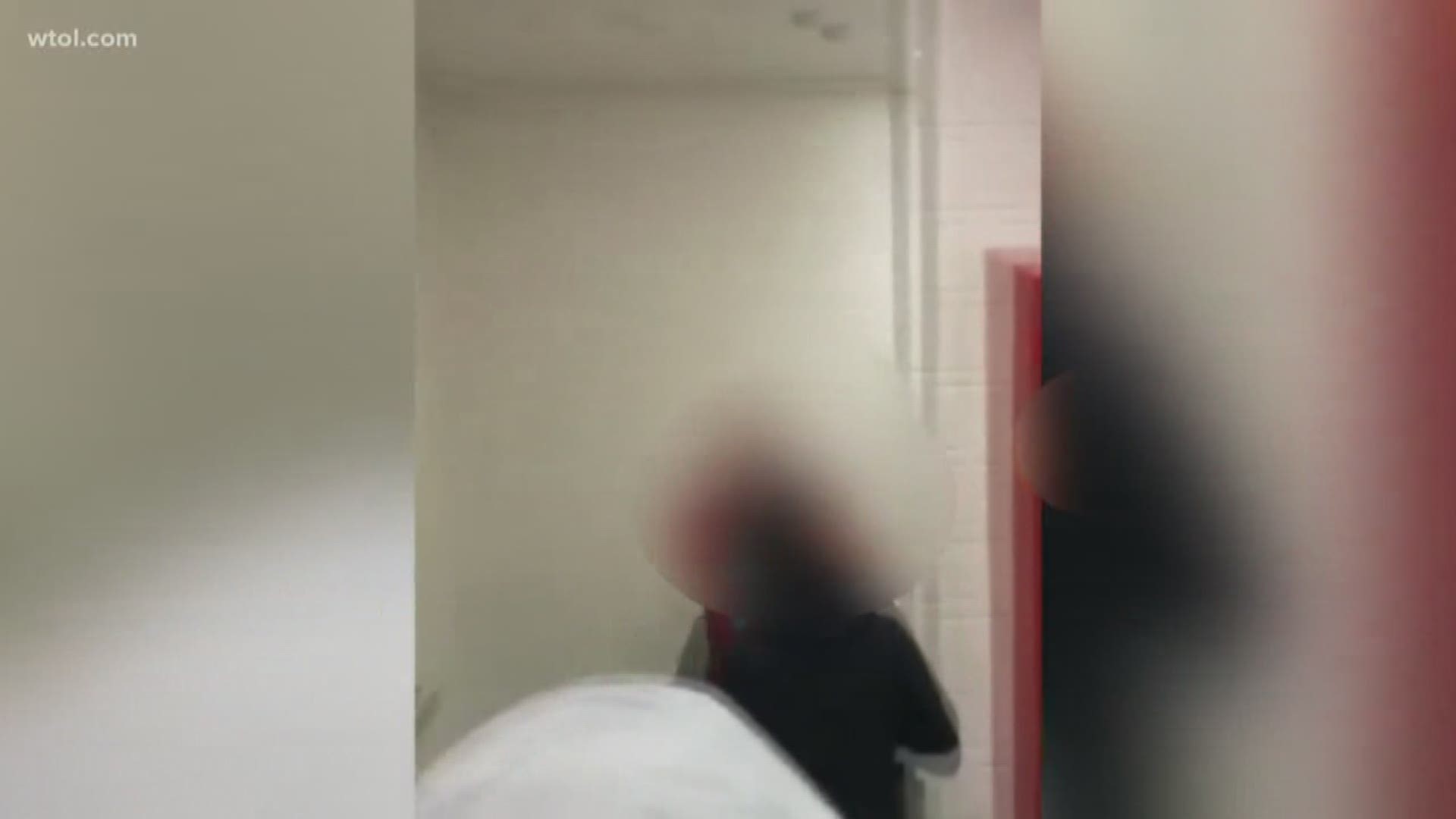 The video shows one student punching another in a locker video. School officials said they are taking disciplinary measures against the aggressor.
