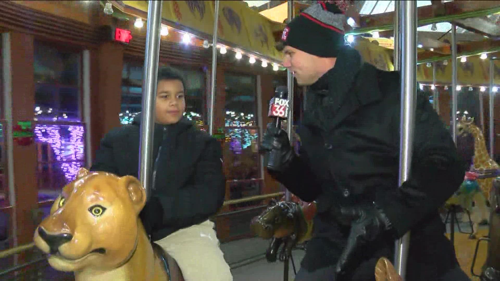WTOL 11's Trent Croci checks out the Toledo Zoo carousel at Lights Before Christmas.