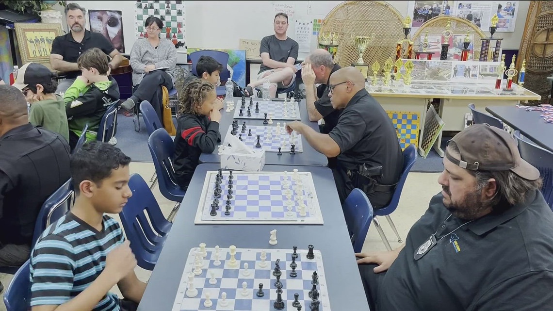 Cops and kids face off in chess at Jones Leadership Academy of Business
