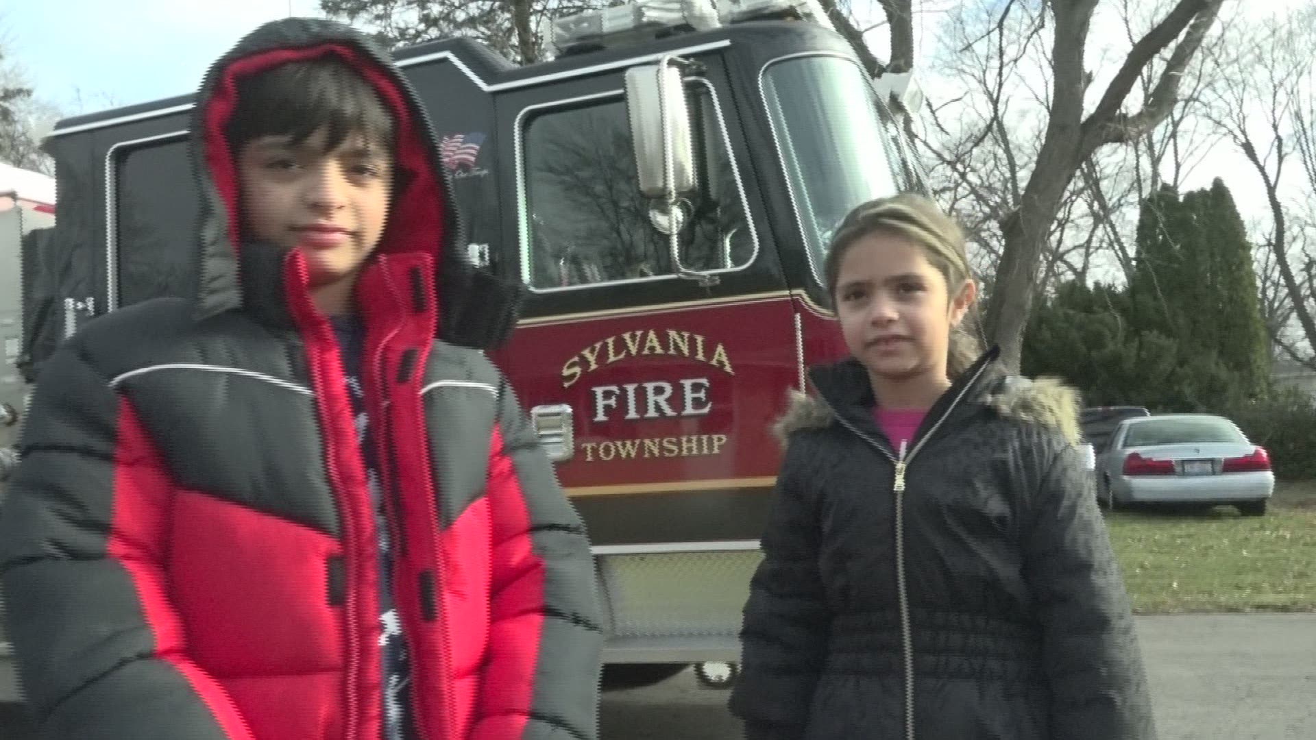 In Santa hats and a make-shift sleigh, the Sylvania Township Fire Department dropped off some stockings filled with gift cards to a few local families in need.