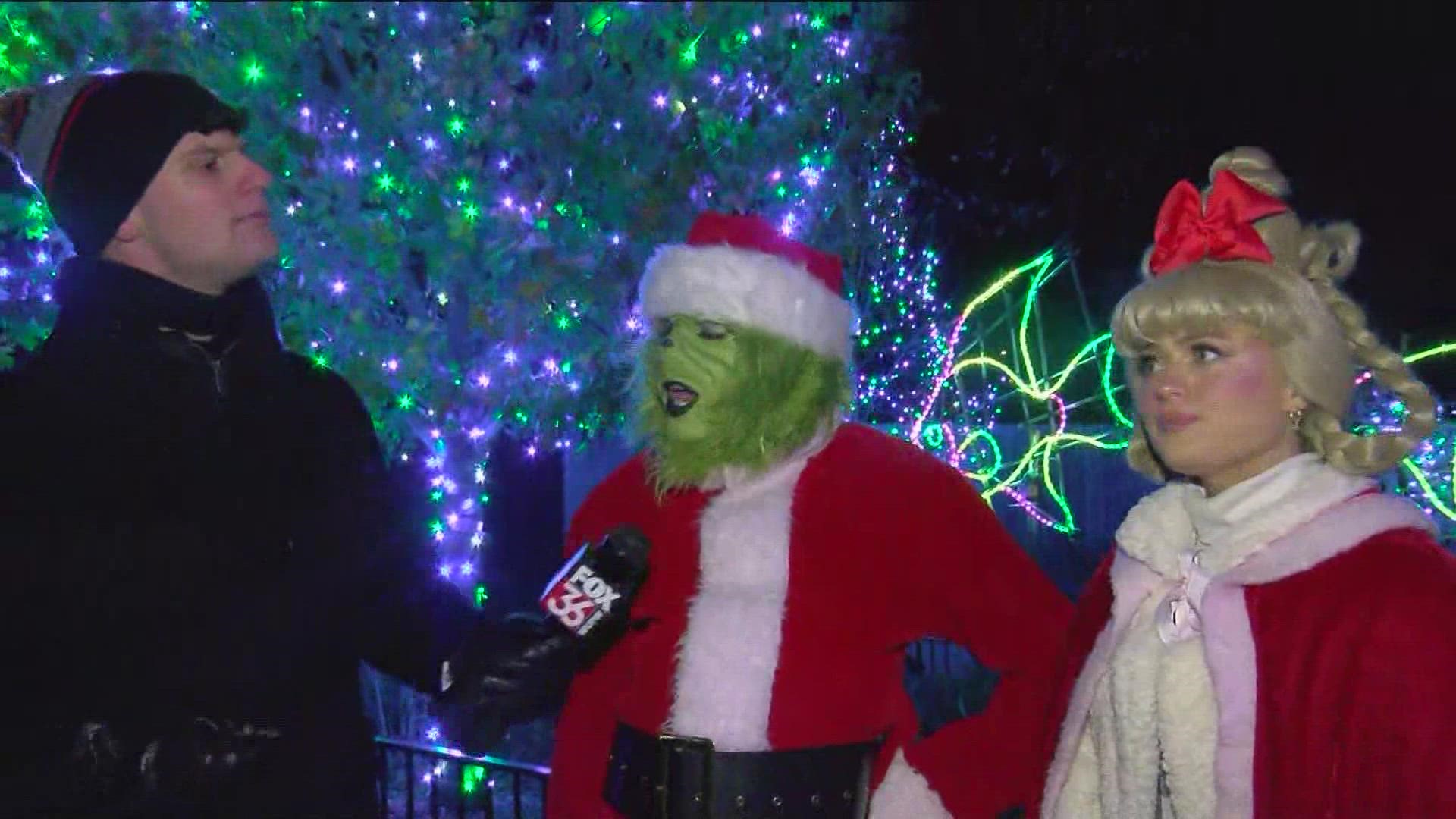 The Grinch and Cindy Lou Who talk with Trent Croci at the Lights Before Christmas.