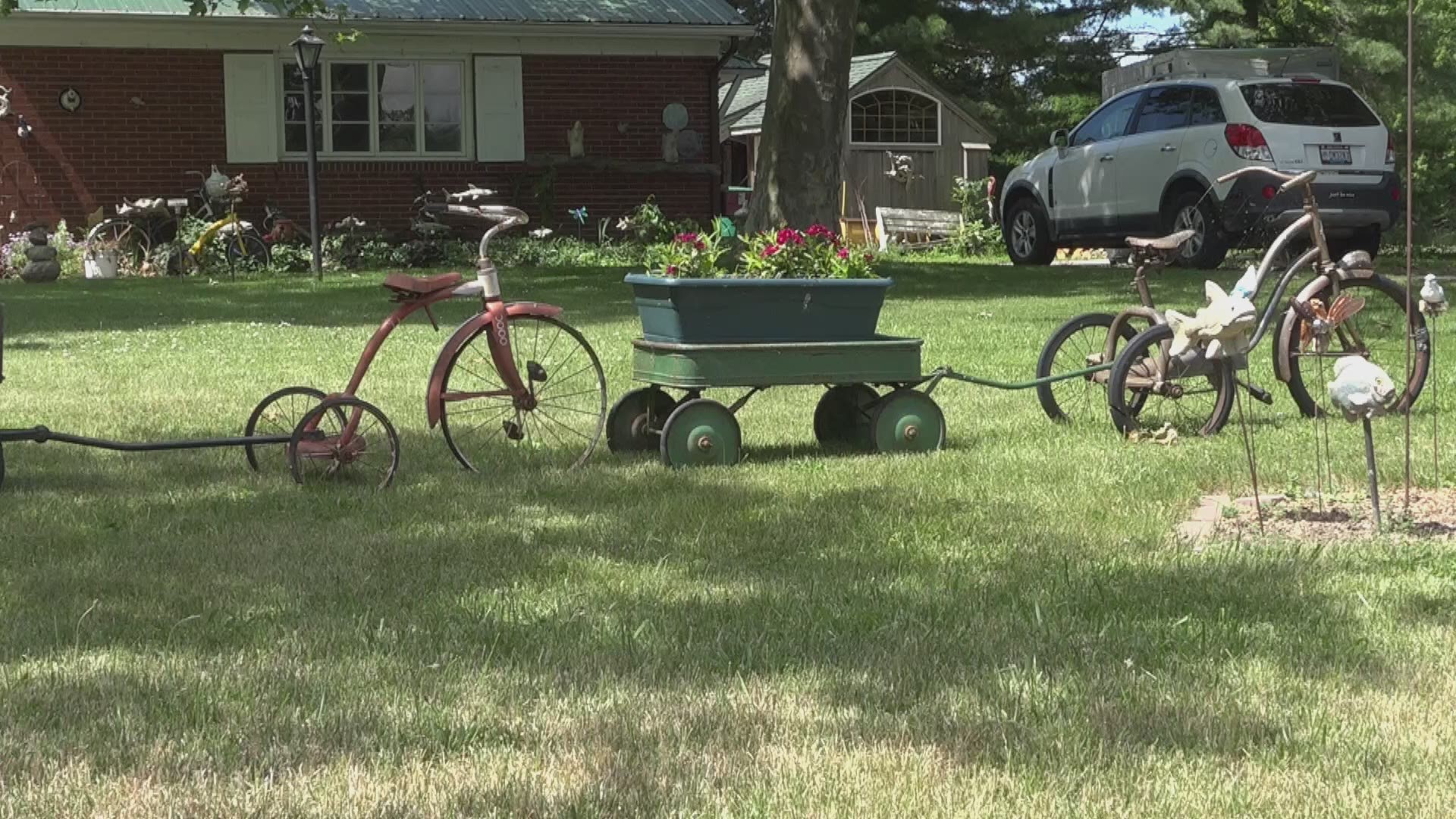 An Oak Harbor couple's yard art keeps thoughts turning to childhoods of yesteryear, as a collection of trikes dots their lawn.