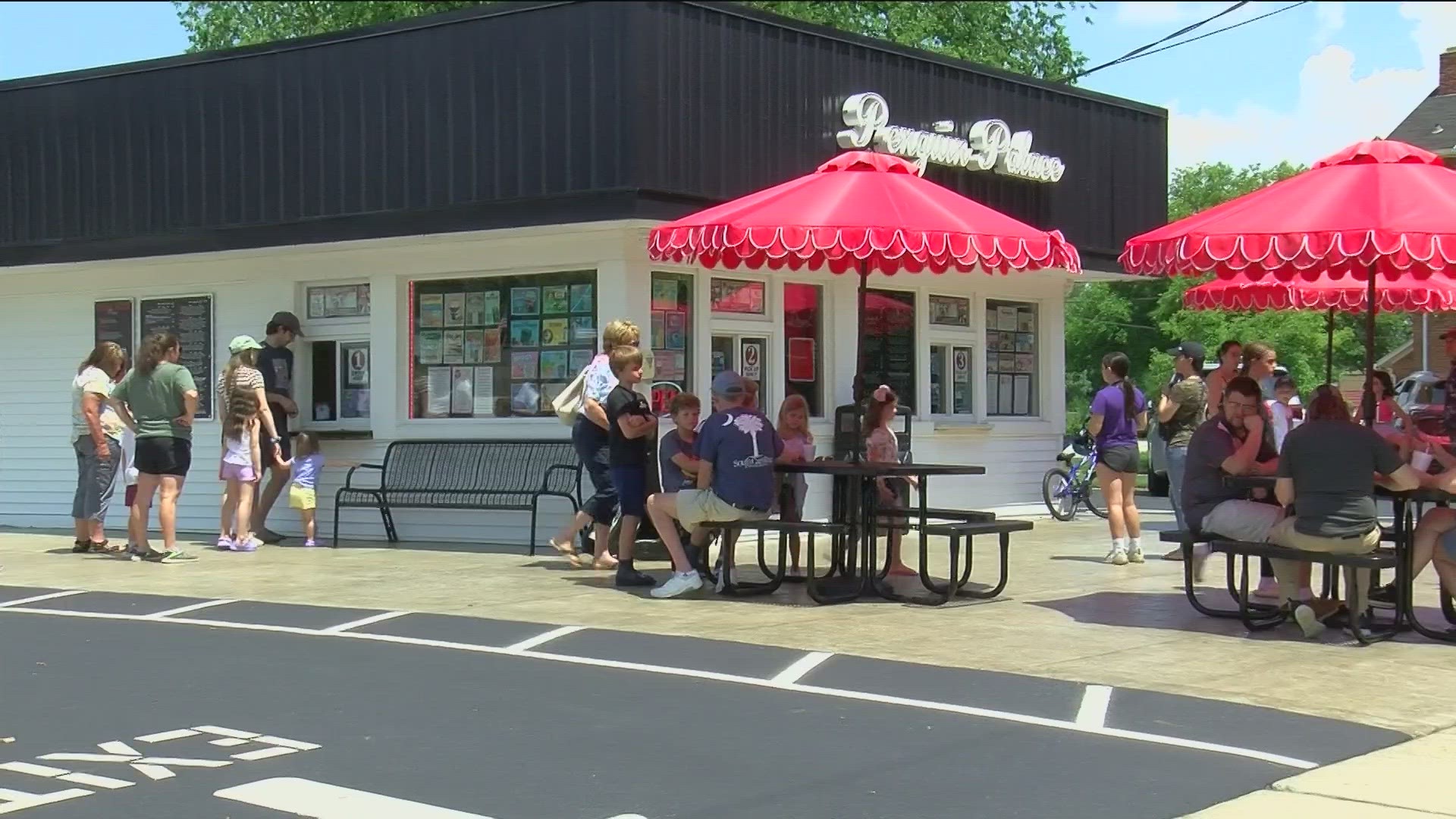 A storm ripped off the roof of Penguin Palace 3 months ago. Hundreds of people stood in line for a scoop of ice cream at the reopening of the popular spot in Maumee.