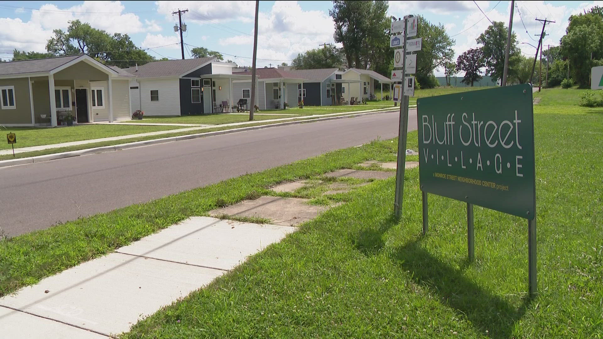 Larry Clark, the project manager with Bluff Street Village, talks with Dan Cummins about what the homes are all about.