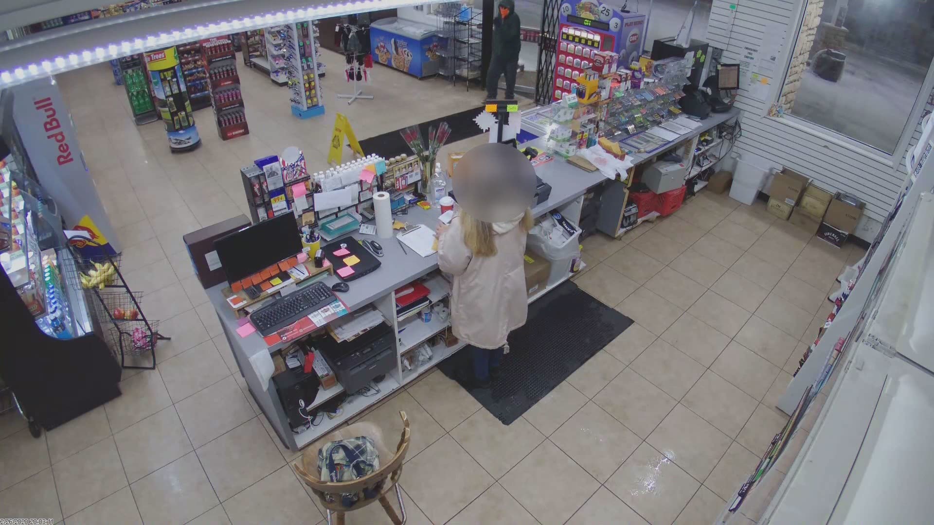 A clerk at the Stop & Go in Sylvania Township called 911 to report a car running outside for nearly an hour. Video shows the robber with a large knife.