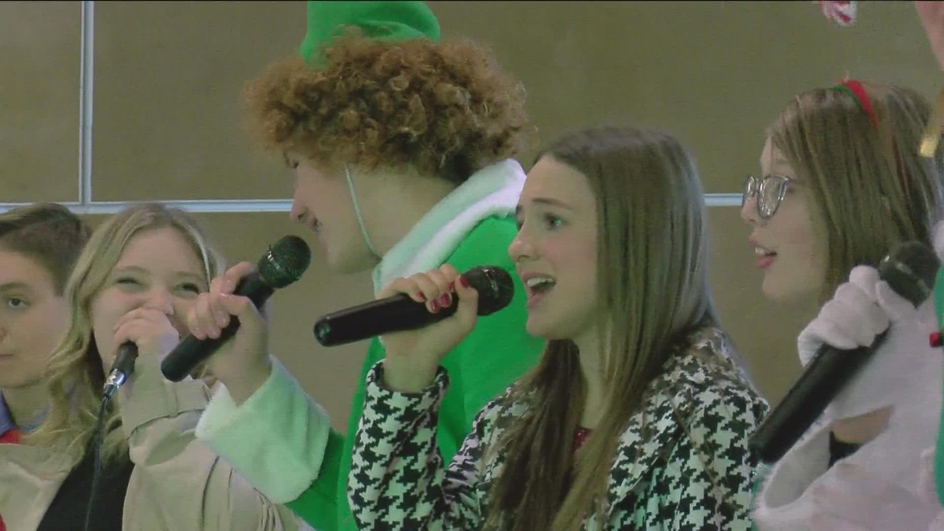 The kids were there to spread the holiday spirit to shoppers as well as raise awareness for the theater and its production of Elf Jr. the Musical.