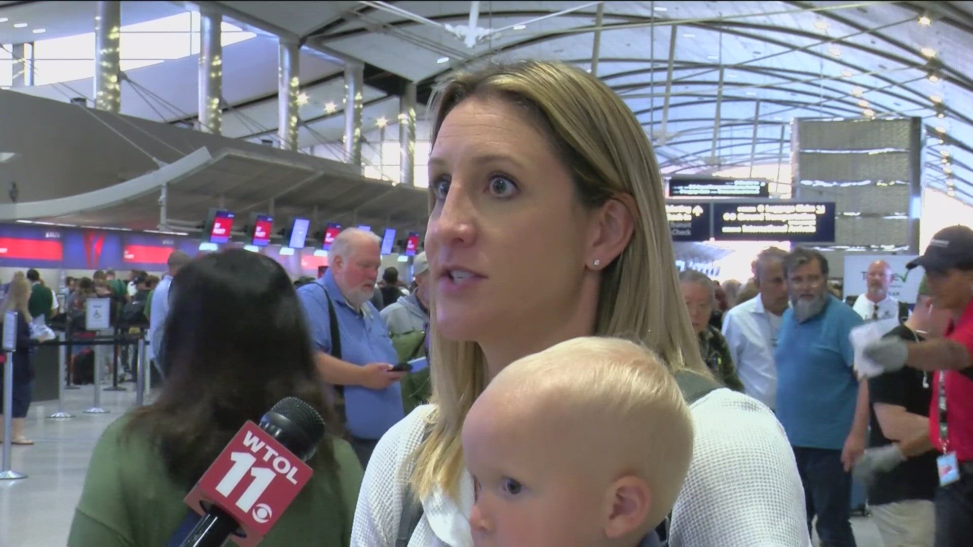 WTOL 11 Reporter Silver Barker chatted with travelers at Detroit Metro Airport, who were stranded after a global tech outage grounded flights Friday.