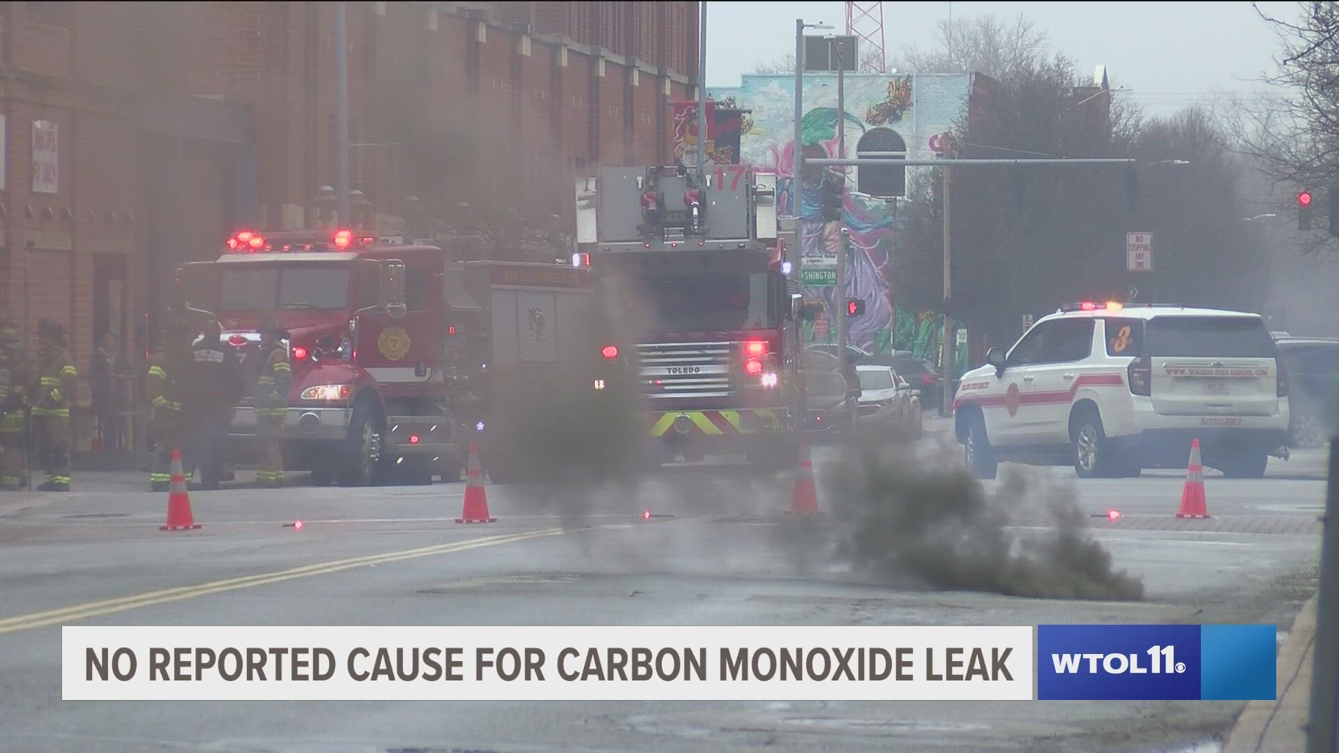 Authorities shut down the intersection of Monroe Street and Huron Street late Saturday morning after smoke was detected rising from a manhole.