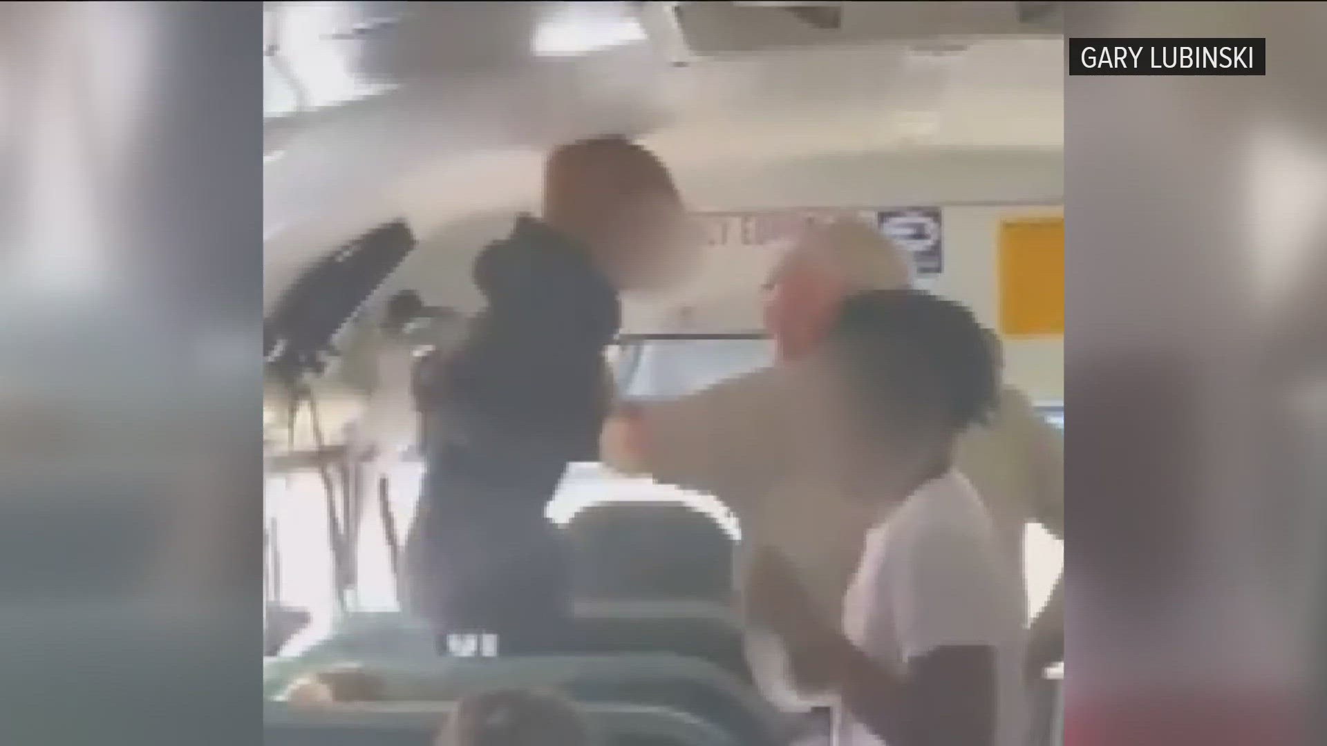The bus driver can be seen grabbing a girl by the wrists and pulling her out of her seat in both videos as he attempts to deal with the situation.