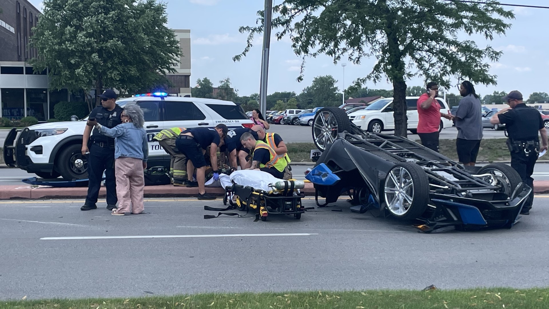 Slingshot-style vehicle upended on Central Avenue; victim hospitalized