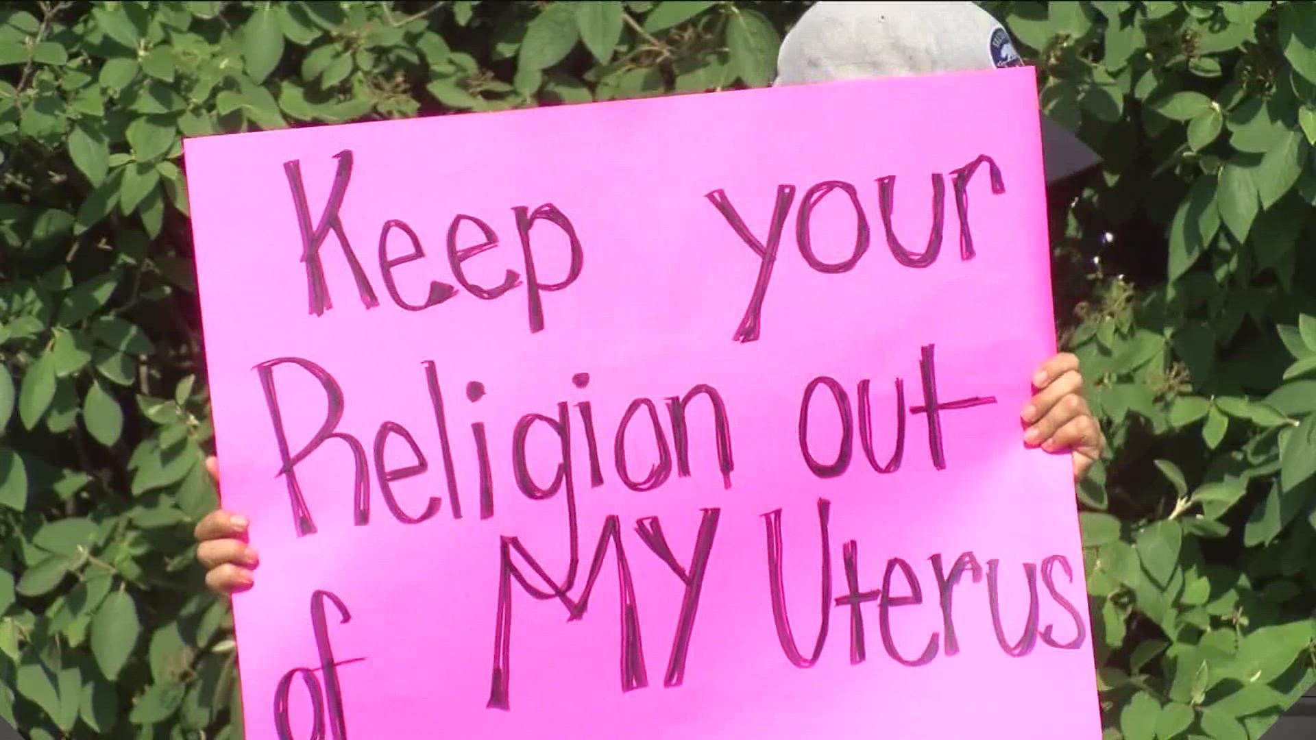 A small group of protesters lined the street near Cedar Creek Church on Sunday morning, frustrated the church hasn't taken a clear stance on the abortion issue.