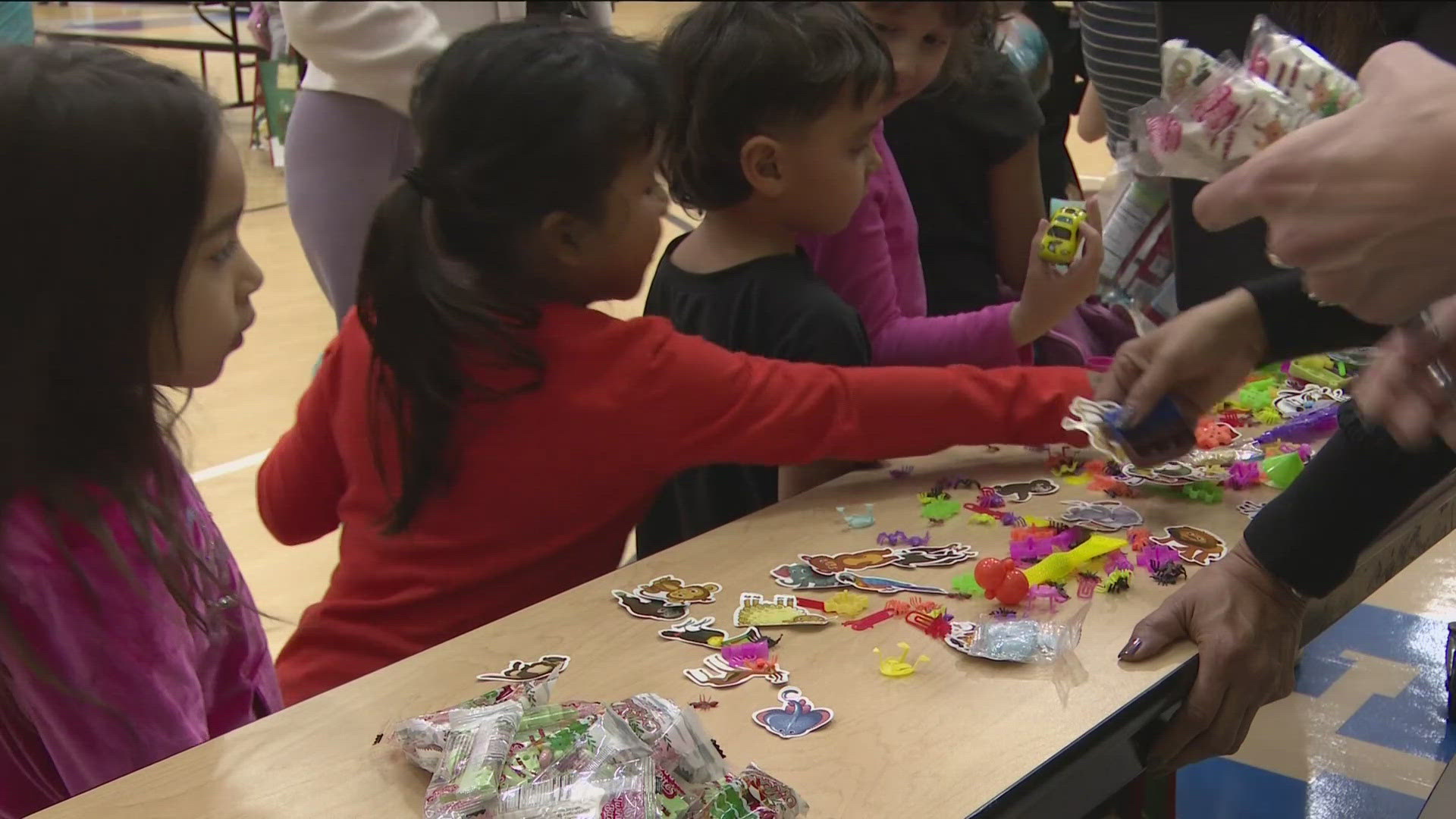 Two hundred students lined up to get gifts from several organizations including Susie's Coats, Designetics, Connecting Kids to Meals and the Toledo Zoo.