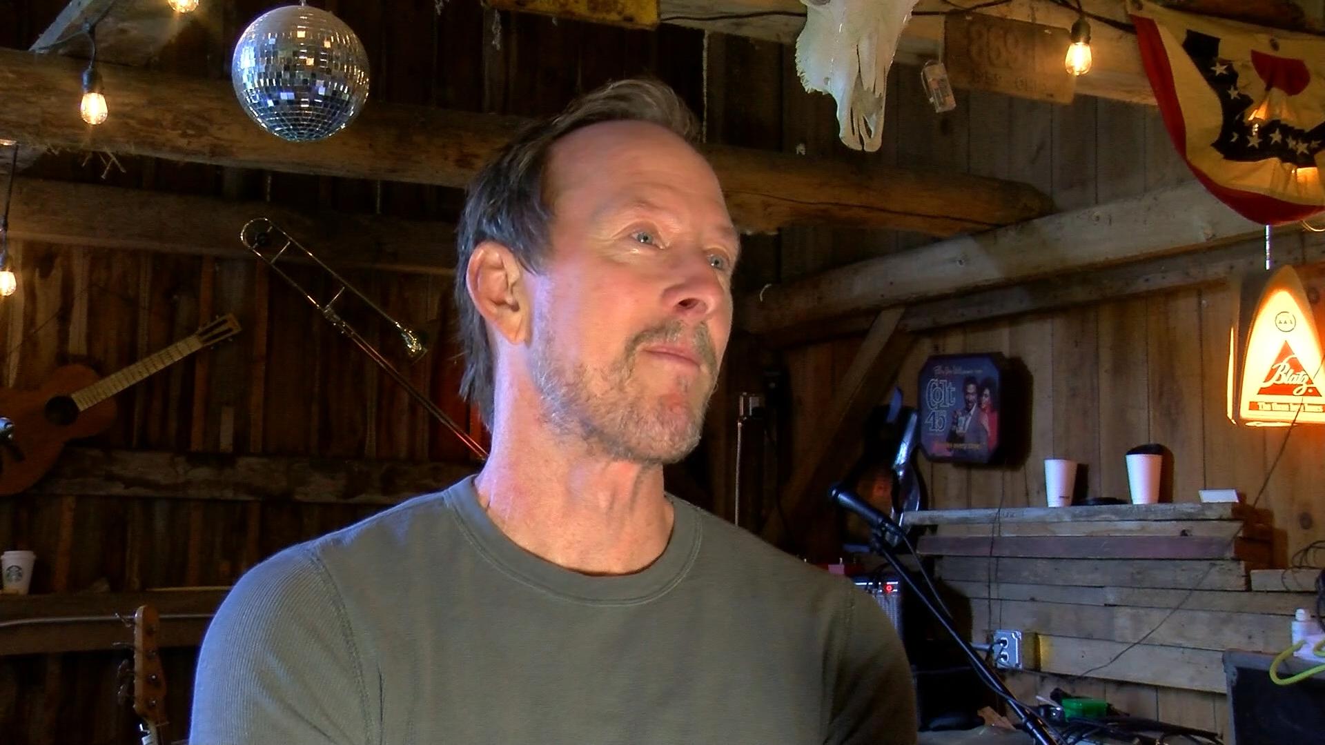 Scott Shriner, current bassist with Weezer and bassist for Loved by Millions, talks about the tribute concert on Friday at TSA Black Box Studio in honor of EJ Wells.