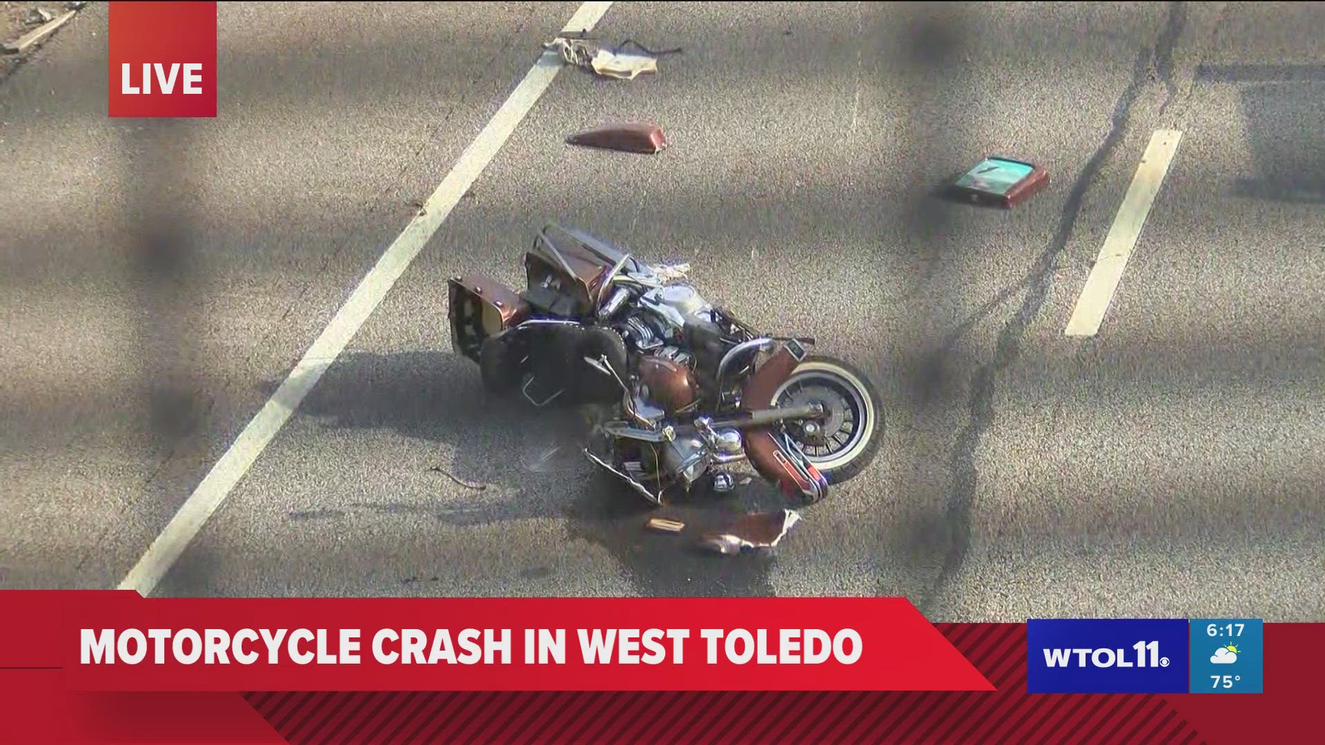 Police were still investigating at the crash site more than two hours after the road was closed where a motorcycle could be seen lying in the middle of the highway.
