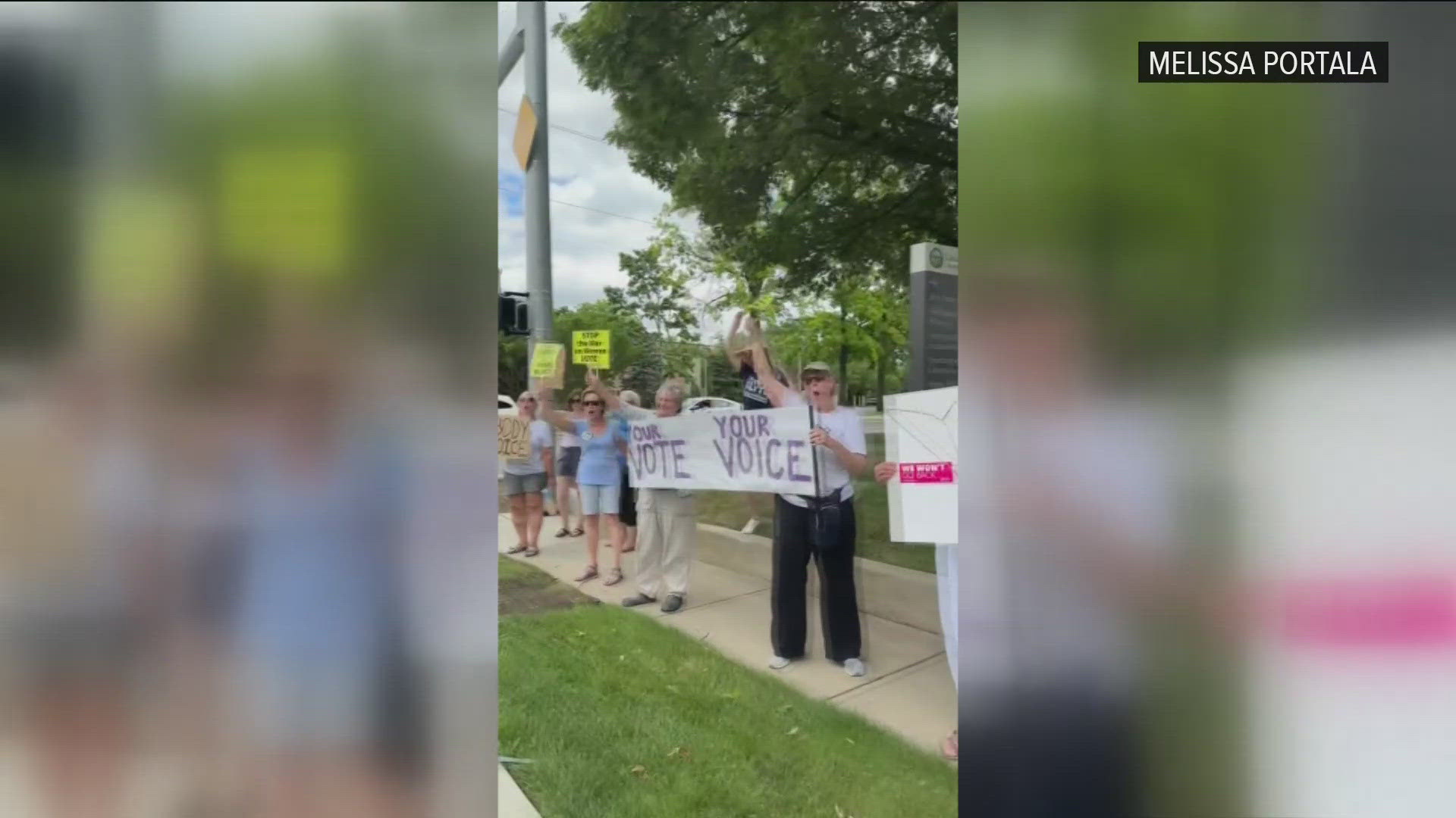 Dozens of people held signs and rallied in west Toledo Sunday to mark two years since the Supreme Court decision to overturn Roe v. Wade.