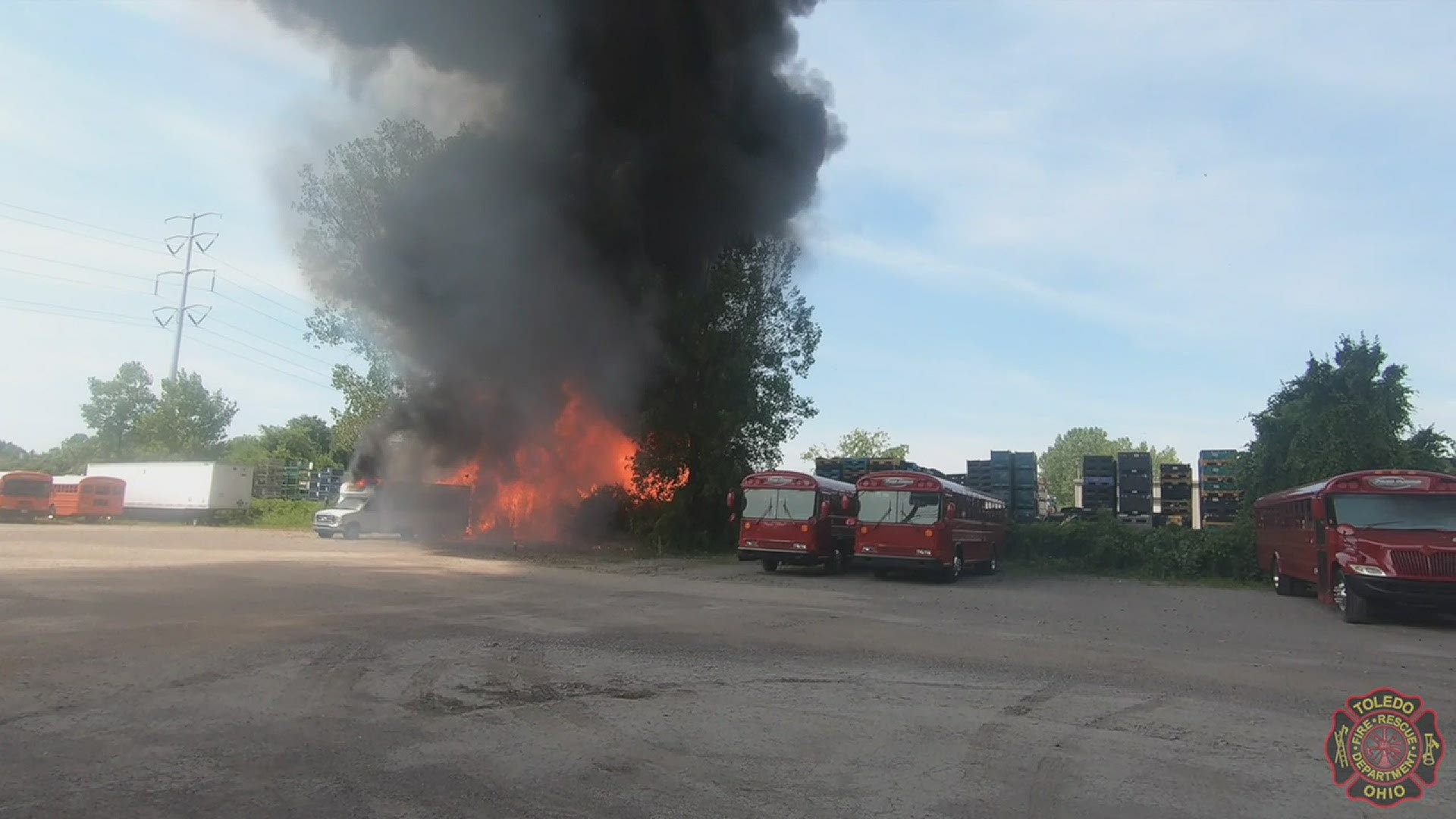 Crews say multiple plastic pallets caught fire.