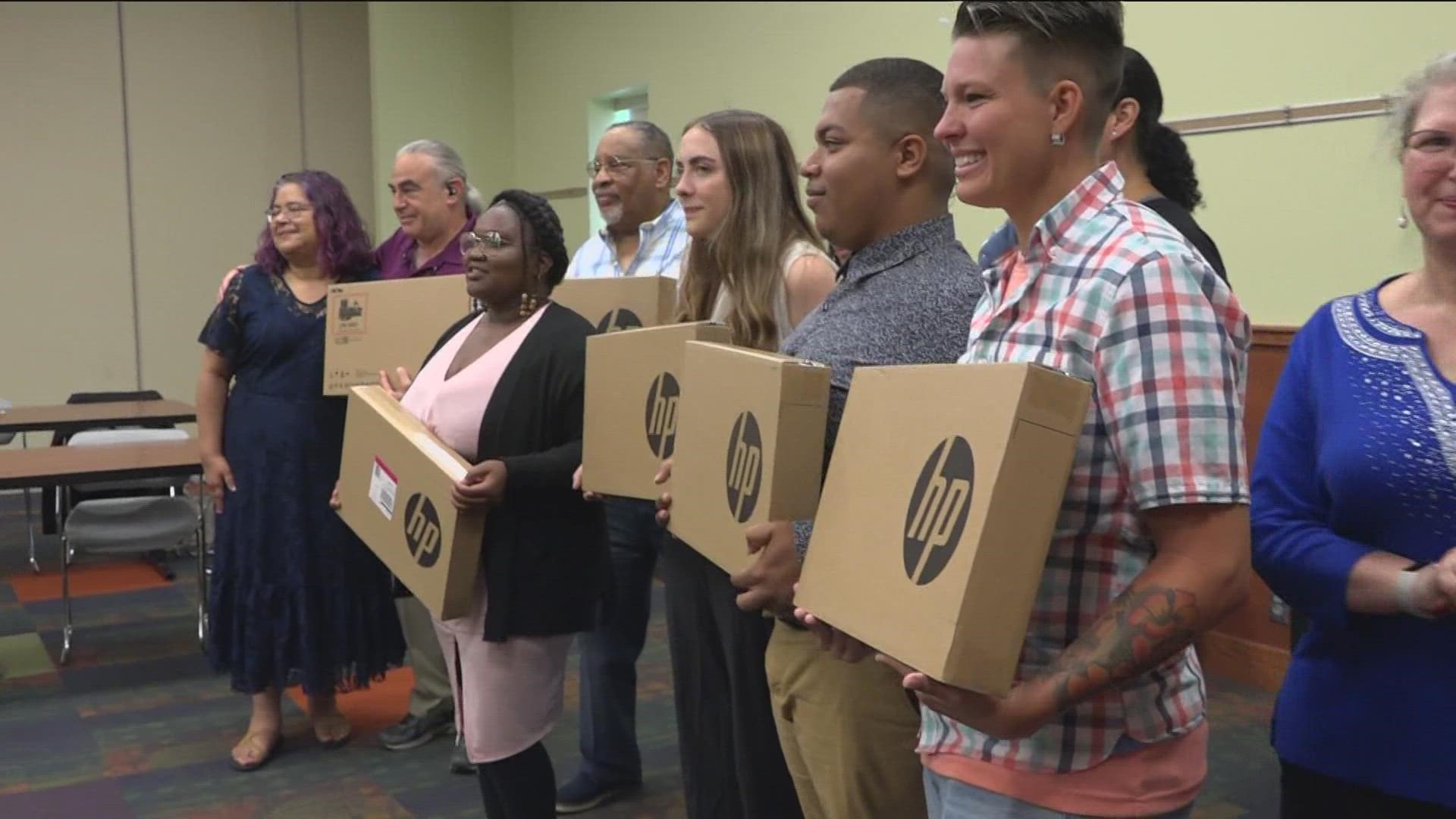 Graduates of the program received new laptops.