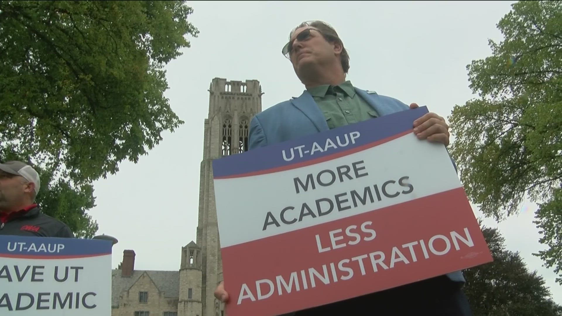 Members of a part of the American Association of University Professors at UToledo rallied Wednesday against budget cuts.