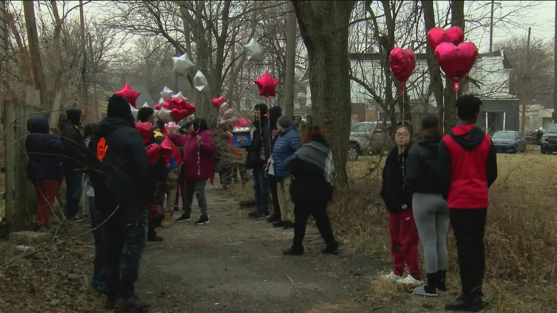 Nearly 100 people gathered in the alley where De'Asia Green was found dead, but a gunshot-like noise ended the night early.