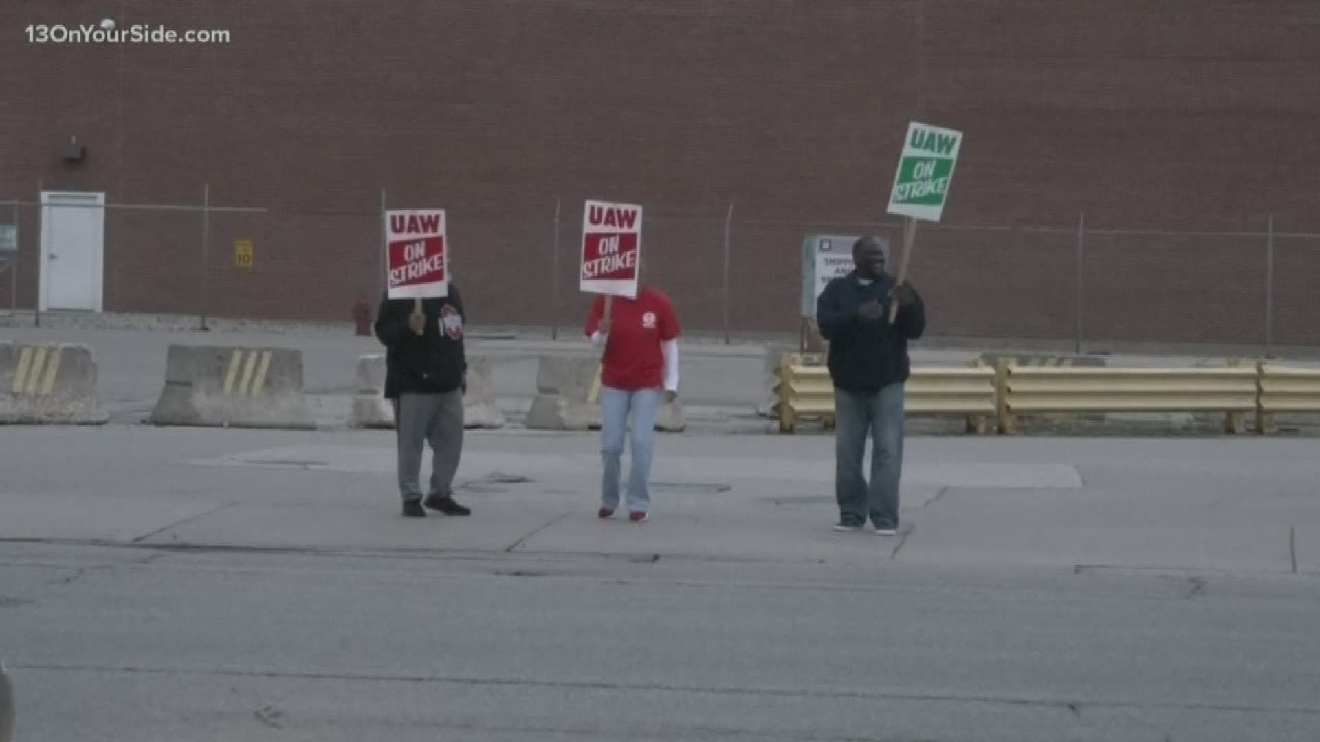 General Motors says striking workers will get company-paid health insurance, nine days after saying coverage would be cut off, due to significant member confusion.