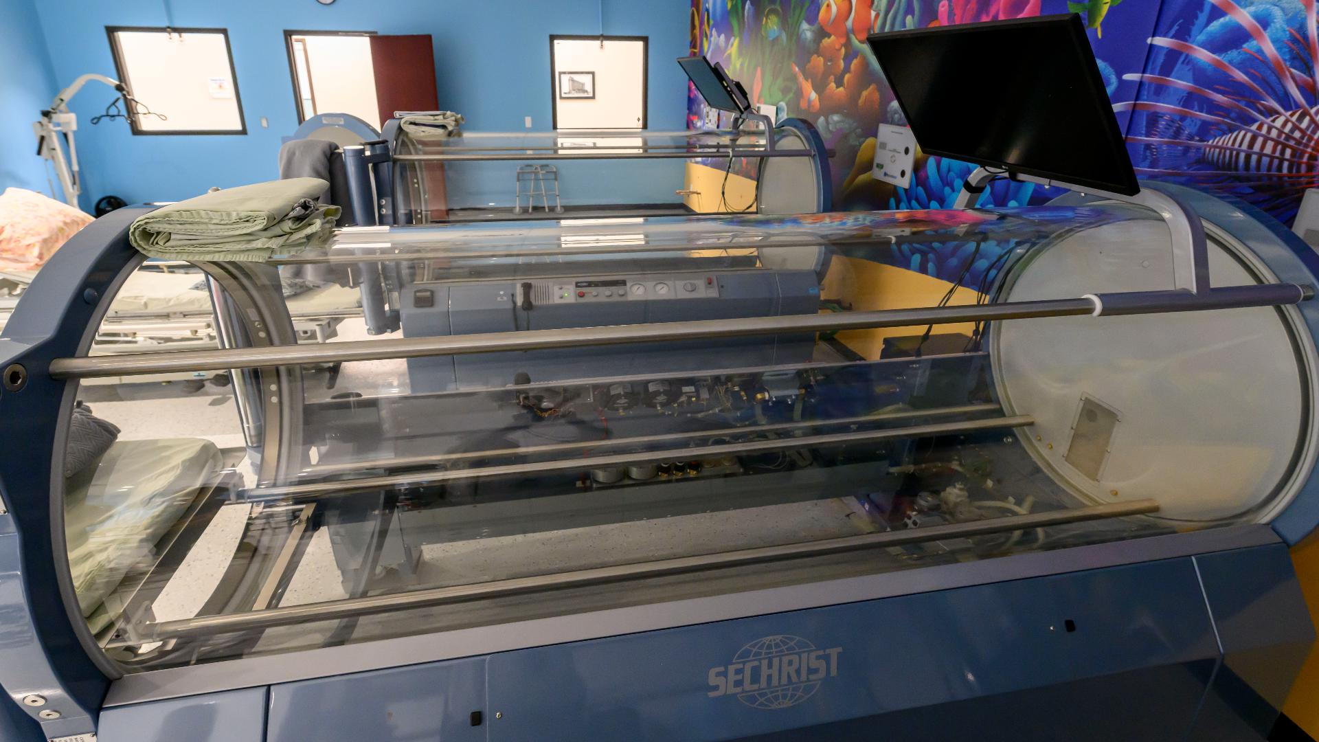 His mother was standing next to the hyperbaric chamber and suffered injuries to her arms when it exploded Jan. 31 at the Oxford Center in Troy.